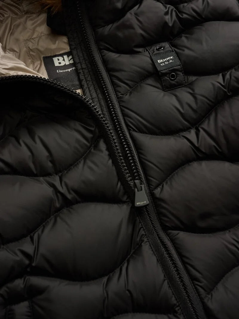 Piumino lungo ad onde con pelliccia Lynel